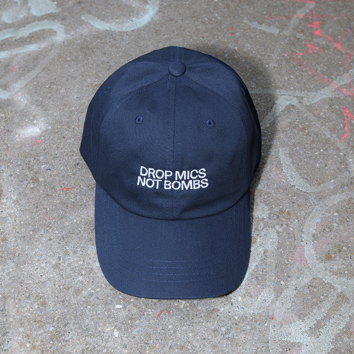 CAP "DROP MICS NOT BOMBS"