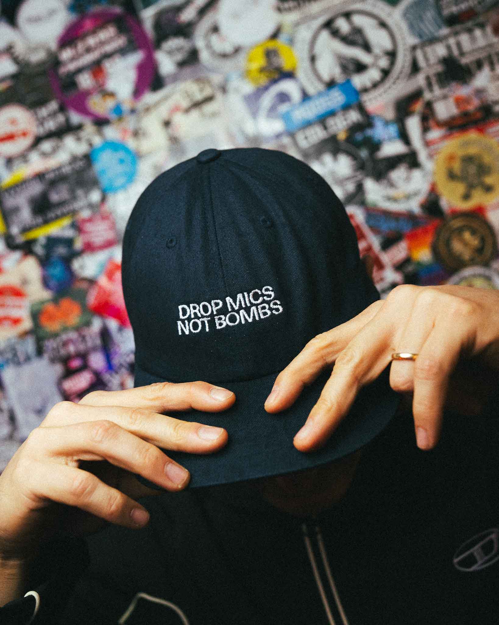 CAP "DROP MICS NOT BOMBS"